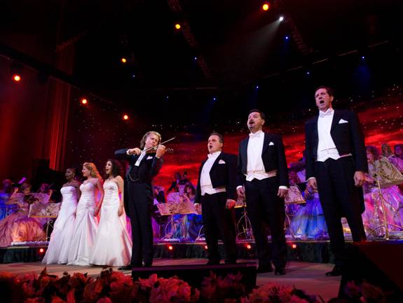 ANDRÉ RIEU  (center)  with his singers and orchestra
